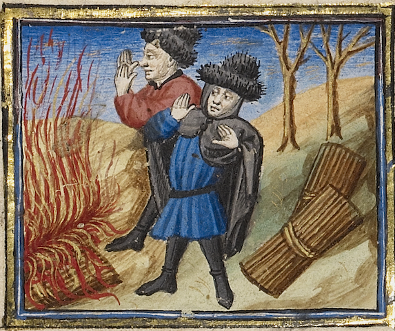 illumination of two men warming hands at a bonfire