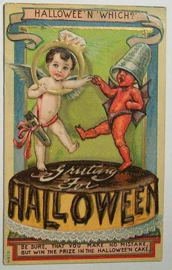 angel and demon babies holding ring and thimble atop cake frosted "HALLOWEEN"