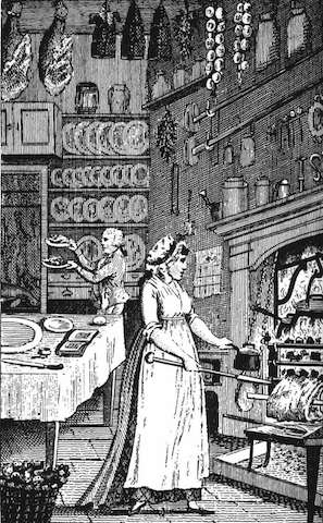 female cook at oven in high-ceilinged kitchen